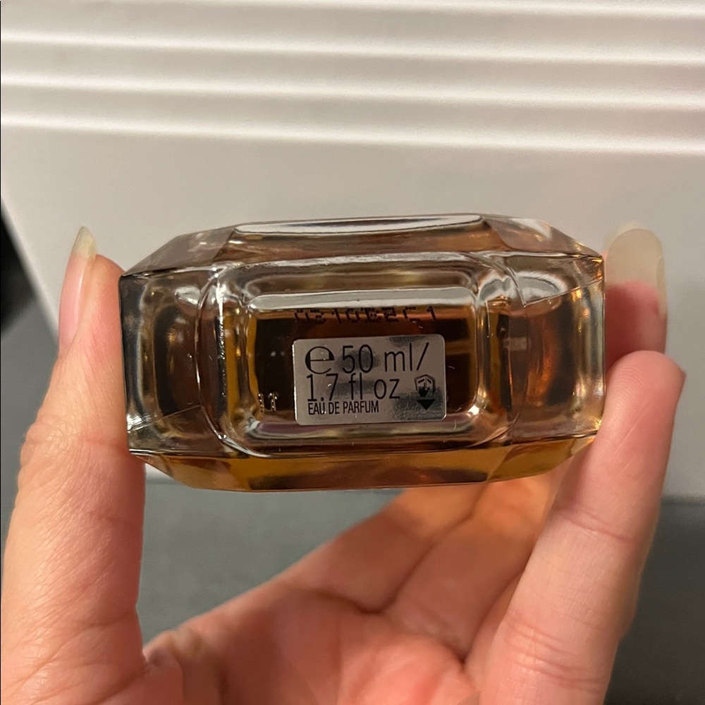 Victoria's Secret Scandalous Perfume with Black Cap and Gold Hue - Picture 3 of 3